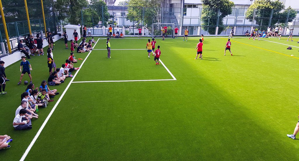 Artificial grass playing field