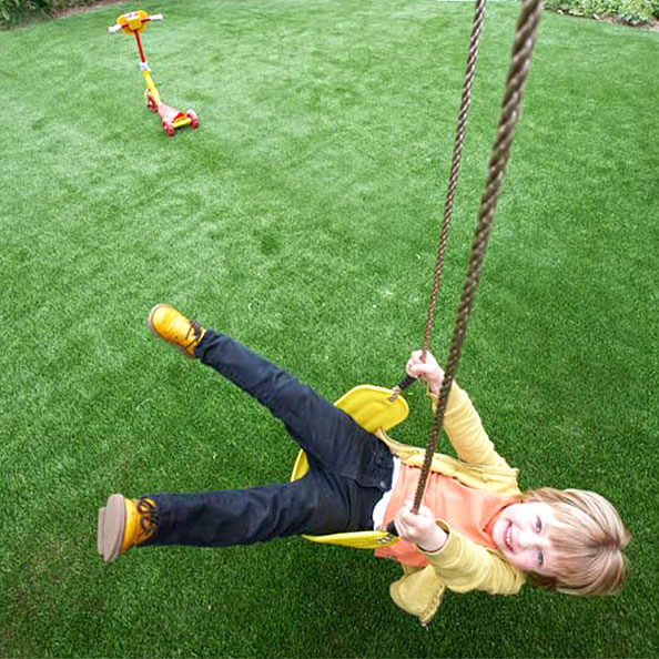 grass under playground swings