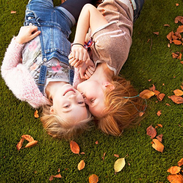 kids play on artificial grass